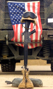 030427-M-4066S-013
Qalat Sikar Air Base, Iraq (Apr. 27, 2003) Ð An M16-A2 service rifle, a pair of boots and a helmet stand in tribute to a fallen Marine Corps Sergeant assigned to Marine Wing Support Squadron Three Seven One (MWSS-371), killed in action in Iraq during Operation Iraqi Freedom.  U.S. Marine Corps photo by Lance Cpl. Jonathan P. Sotelo.  (RELEASED)